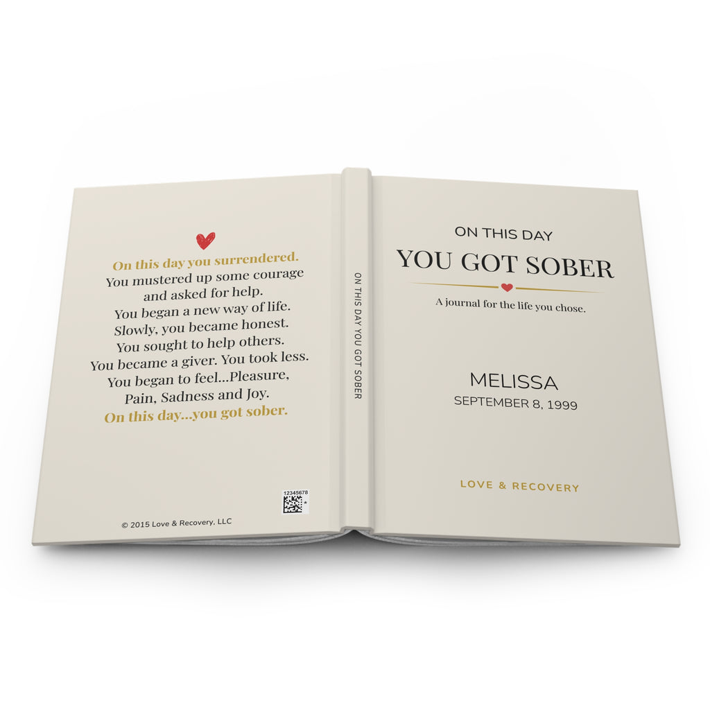 Personalized sobriety journal opened flat to show the front cover, spine and back-cover poem