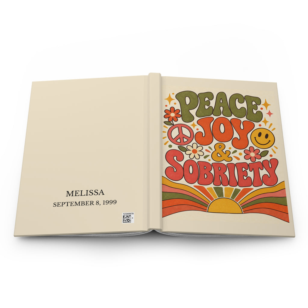 Personalized sobriety journal opened flat showing the front cover, spine, and personalized name and date