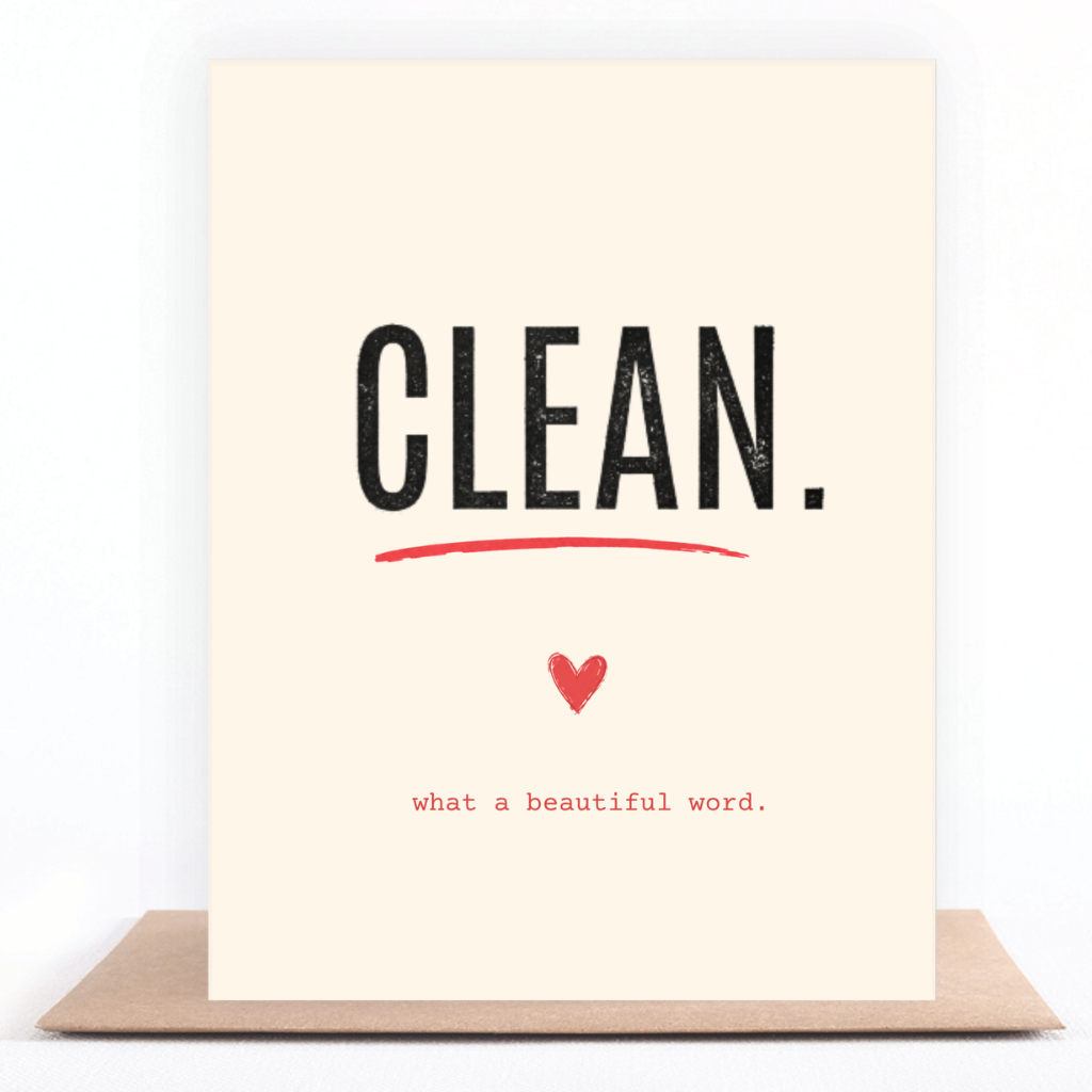 A vertical cream-colored greeting card with the word 'CLEAN.' in large black letters, underlined in red, with a small red heart and the phrase 'what a beautiful word.