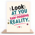 ook At You, Raw-Dogging Reality greeting card standing on a kraft envelope