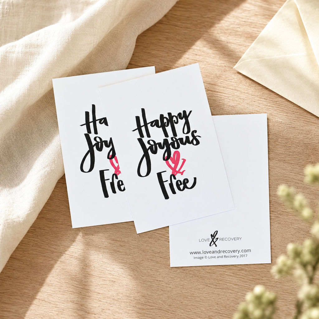 White encouragement cards with Happy Joyous & Free on the front; blank on the back.
