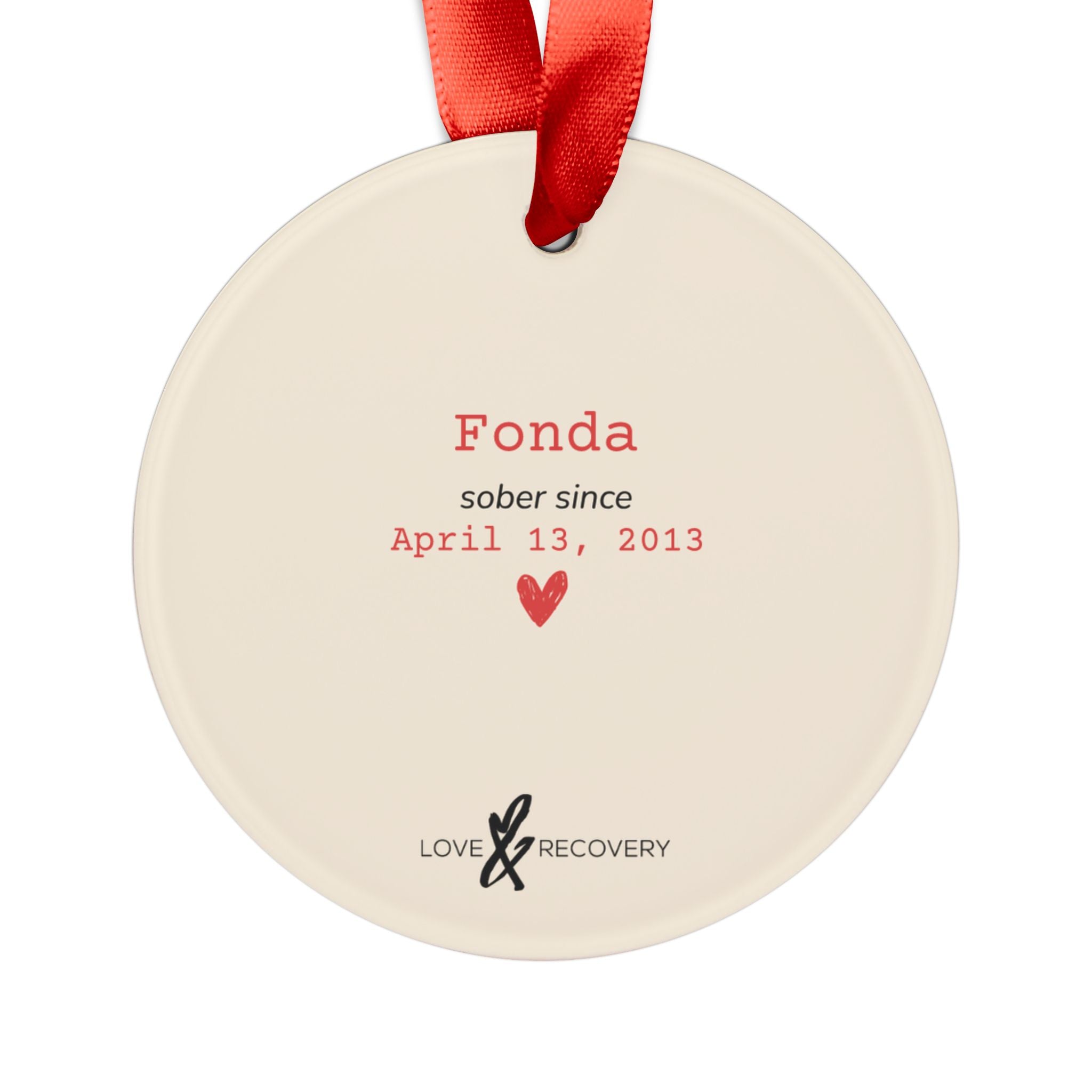 Back of the personalized sobriety ornament with example custom name, sober date, and the Love & Recovery logo