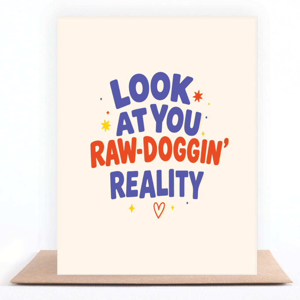 Colorful sobriety card reading “Look at You Raw-Doggin’ Reality” displayed with a kraft envelope.